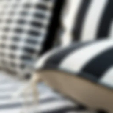 Close-up of the texture and fabric of a black and white striped outdoor seat cushion