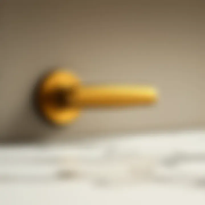 Close-up of champagne bronze handle against a textured backsplash