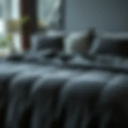 Luxurious dark grey velvet quilt on a modern bed