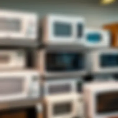 Various brands of small white microwave ovens on display