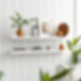 Elegant Display of Decorative Items on White Metal Floating Shelf Elegant white metal floating shelf showcasing decorative items